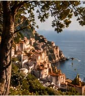 A Mediterranean coastal town seen through pine branches